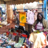 Jemimah reading her devotional book called "Women of the Bible" while she was sitting in the marketplace.